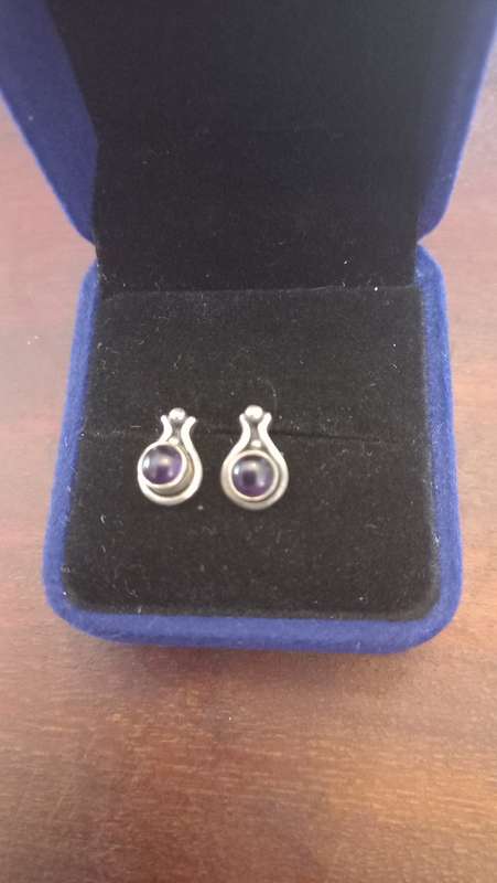 Sterling silver earrings with purple stone