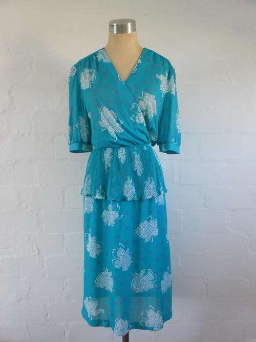 VINTAGE TURQUOISE BLUE FLORAL PRINT PLEATED PEPLUM CRISS CROSS DRESS - SIZE 12