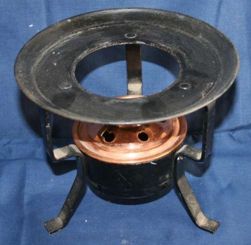 A FANTASTIC VINTAGE/ANTIQUE COPPER BURNER IN A BLACK METAL STAND
