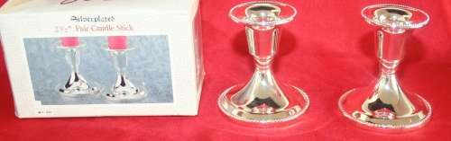 A BEAUTIFUL PAIR OF SILVER PLATED CANDLE HOLDERS STUNNING