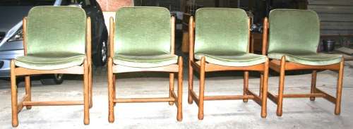 A COLLECTION OF 4 MAGNIFICENT VINTAGE OAK LOOKING DINGING OR BOARD ROOM CHAIRS COVERD IN LIGHT GREAN