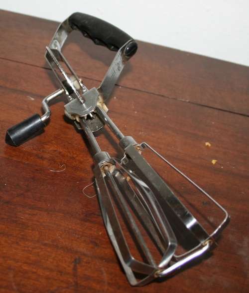 Retro vintage hand mixer. Black top handle and knob. In good vintage condition. Still works properly