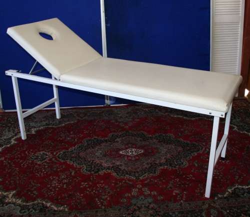 A BEAUTY/MASSAGE BED IN VERY GOOD CONDITION UP FOR GRAB
