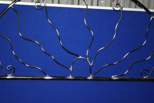 A INTERESTING DESIGNED METAL DOUBLE HEAD BOARD THAT YOU CAN FINISH IN YOUR OWN COLOR