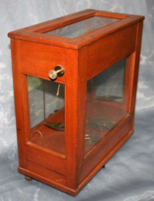 A SPECTACULAR ANTIQUE PRECISION DIAMOND SCALE IN A GLASS CASE WITH A RATCHET DOOR! EX-SAP SCALE!