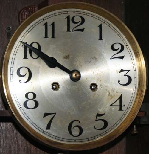 A Spectacular Mignon German Oak Case Striking Wall Clock in perfect working condition