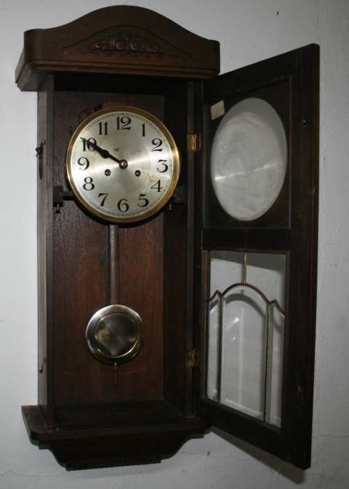 A Spectacular Mignon German Oak Case Striking Wall Clock in perfect working condition