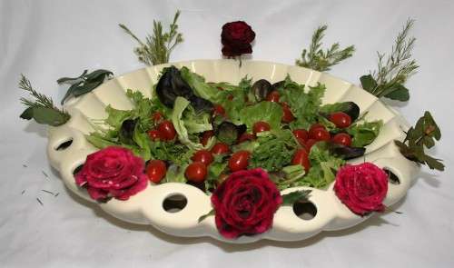 ABSOLUTLEY GORGEOUS LARGE SALAD BOWLS WITH WHOLES TO PUT WATER IN AND FLOWERS ALL AROUND