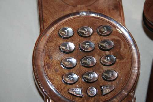 A GORGEOUS ANTIQUE LOOKING SYNTHETIC TELEPHONE IN WORKING CONDITION