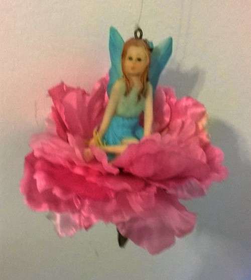 A SWEET ANGEL ON A FLOWER SWING TO CUTE!!!
