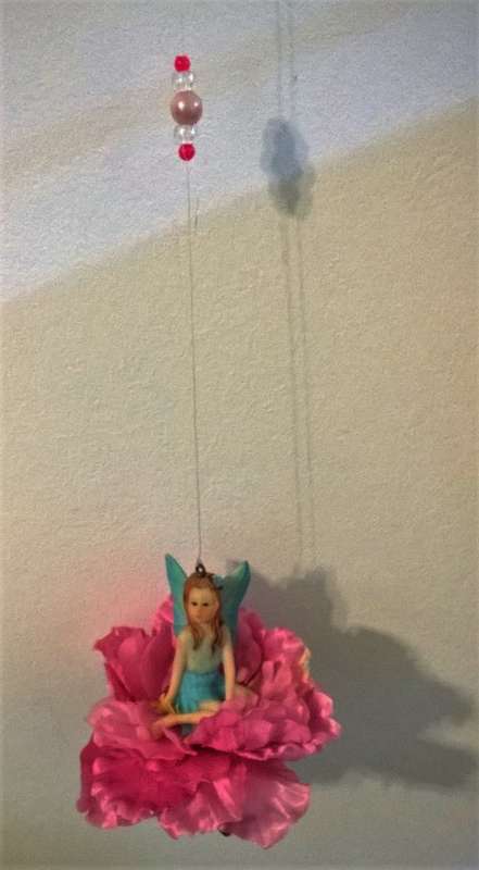 A SWEET ANGEL ON A FLOWER SWING TO CUTE!!!