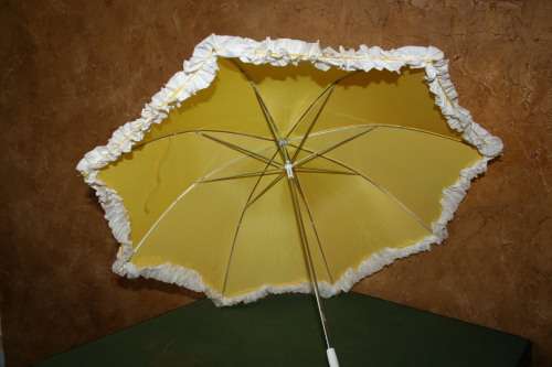 This is a neat vintage umbrella in vibrant yellow with a white trim stunning