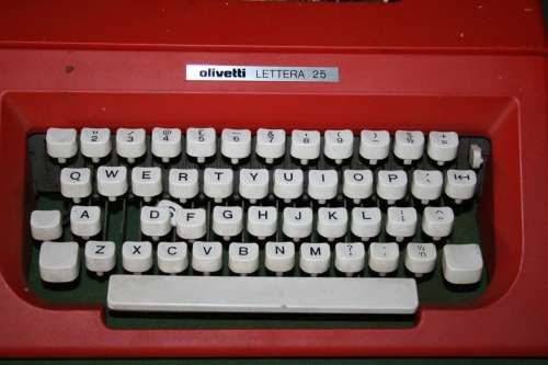 The Olivetti Lettera 25 in a vibrant red is a portable mechanical typewriter
