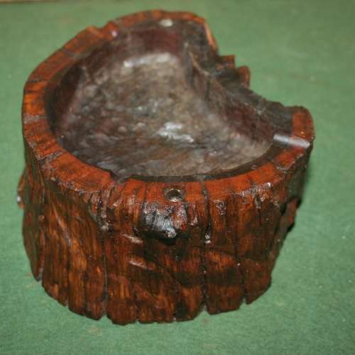 A SOLLID HEAVY PIECE OF WOOD CARVED TO BE A STUNNING ASHTRAY OR USE IT FOR A NICE THICK CANDEL!!