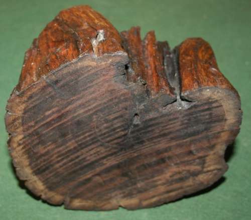A SOLLID HEAVY PIECE OF WOOD CARVED TO BE A STUNNING ASHTRAY OR USE IT FOR A NICE THICK CANDEL!!