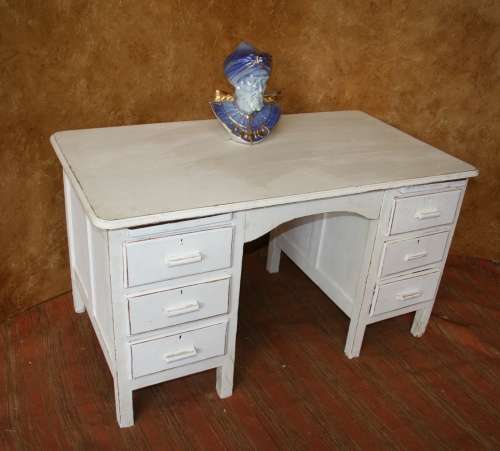 Here I have a charming shabby chic desk with 6 drawers.