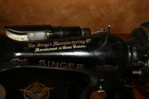 AN INCREDIBLE ANTIQUE  SINGER "TREADLE" SEWING MACHINE IN WONDERFUL CONDITION IN THE ORIGINAL CUPBOA