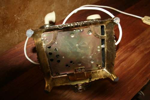 AN EXQUISITE VINTAGE ROTARY DIAL TELEPHONE WITH WHITE BAKELITE HANDLE AND EMBOSSED DETAILING