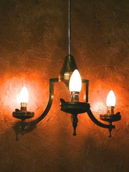 A stately three tier Vintage chandelier . The beautiful 3-light Vintage fixture is stunning working