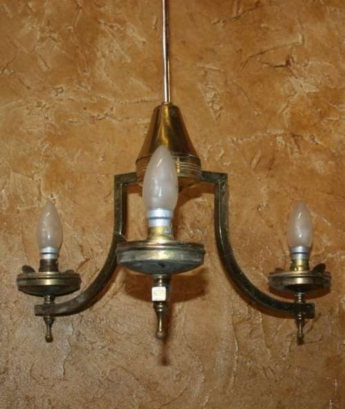 A stately three tier Vintage chandelier . The beautiful 3-light Vintage fixture is stunning working