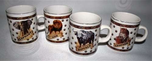 FOUR CUTE MUGS WITH PIC & DESCRIPTION ON THE BACK -  ELEPHANT, LION, BUFFALO, LEOPARD - BID PER EACH