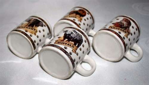 FOUR CUTE MUGS WITH PIC & DESCRIPTION ON THE BACK -  ELEPHANT, LION, BUFFALO, LEOPARD - BID PER EACH