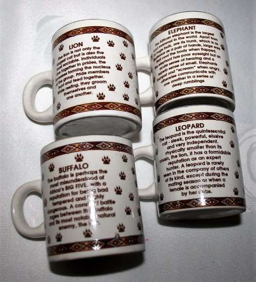 FOUR CUTE MUGS WITH PIC & DESCRIPTION ON THE BACK -  ELEPHANT, LION, BUFFALO, LEOPARD - BID PER EACH