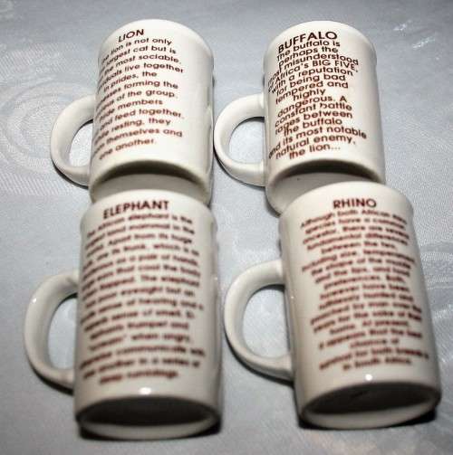 FOUR CUTE MUGS WITH PICTURES & DESCRIPTION ON BACK - * ELEPHANT, LION, BUFFALO, RHINO - BID PER EACH