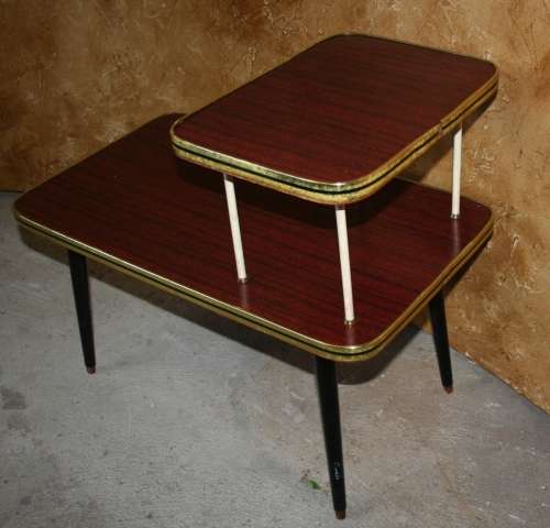 Vintage telephone table/stand. It features a gold colored legs & stunning retro chic tops.
