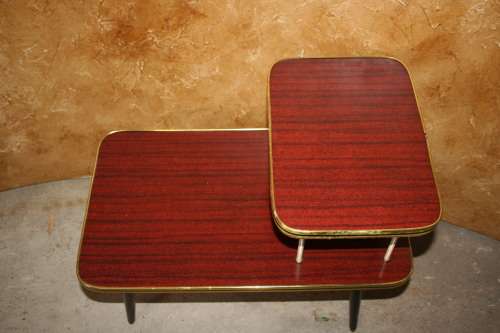 Vintage telephone table/stand. It features a gold colored legs & stunning retro chic tops.