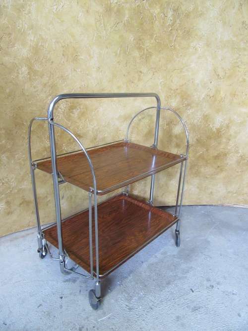 A marvelous Dinette vintage trolley table is one of the most practical serving tables,
