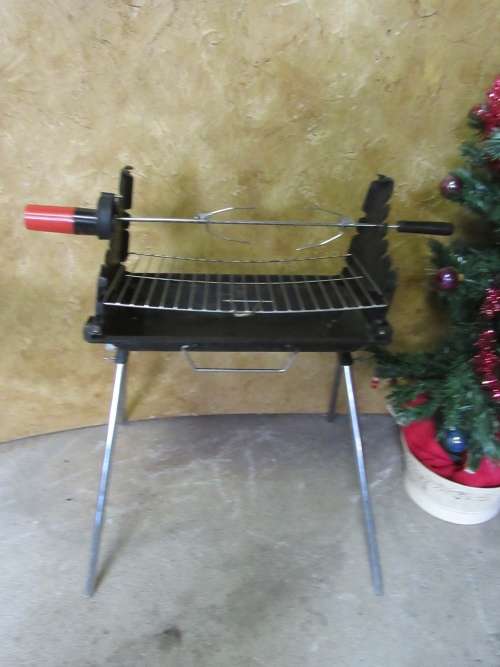 A FANTASTIC HIGH QUALITY FOLD UP BRAAI WITH A LITTLE ROTISSERIE