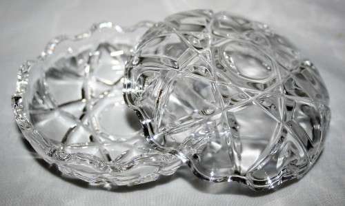 Here is a small, beautiful, round cut glass trinket dish with an unusual saw toothed edge on both