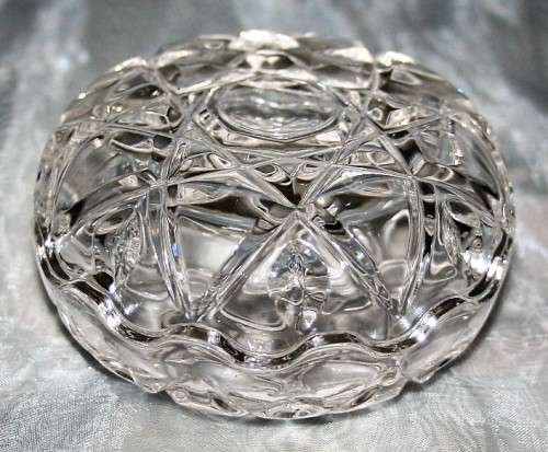 Here is a small, beautiful, round cut glass trinket dish with an unusual saw toothed edge on both