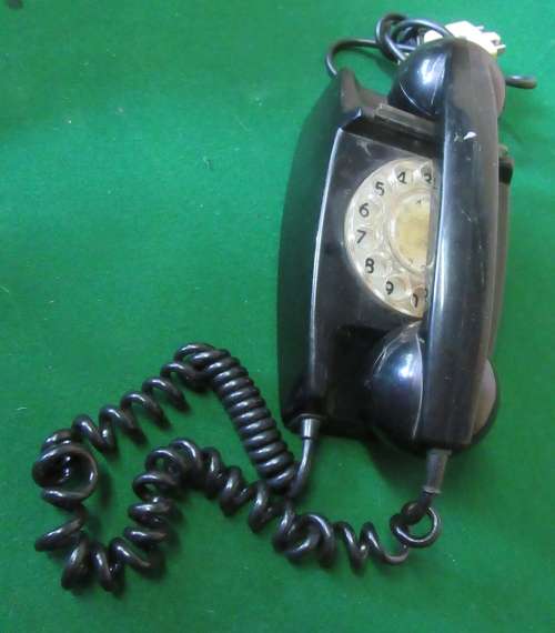 Beautiful vintage rotary telephone in black color and traditional shape A wonderful retro home DECO