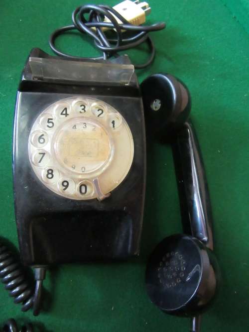 Beautiful vintage rotary telephone in black color and traditional shape A wonderful retro home DECO