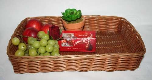 Beautiful medium size hand woven grass basket with handles each side.