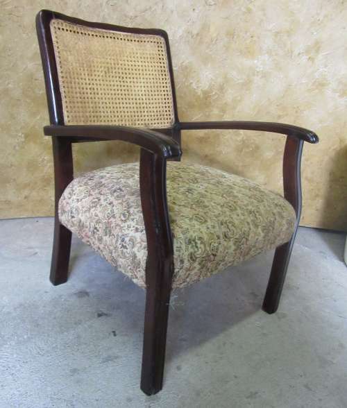 A SPECTACULAR SOLLID IMBUIA EASY CHAIR WITH RATAN/CANE BACK REST IN GOOG CONDITION