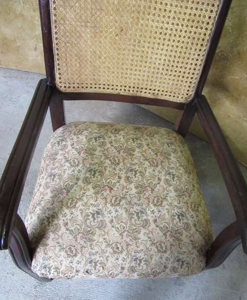 A SPECTACULAR SOLLID IMBUIA EASY CHAIR WITH RATAN/CANE BACK REST IN GOOG CONDITION