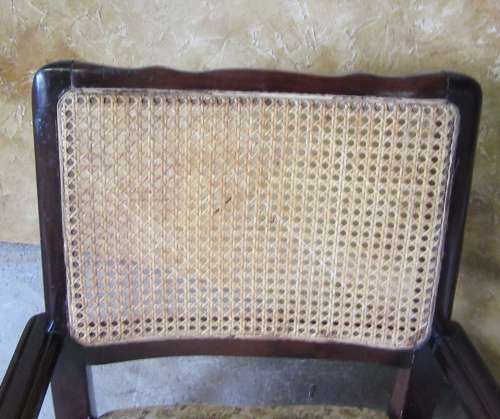 A SPECTACULAR SOLLID IMBUIA EASY CHAIR WITH RATAN/CANE BACK REST IN GOOG CONDITION