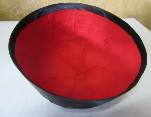 A GORGEOUS BLACK HAT WITH A RED TOSSEL FOR THE HAT COLLECTORS OR FOR THE NEXT HAT PARTY