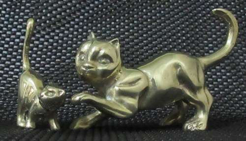 Two solid brass cat figurines circa 1960. Two different poses and pretty detailed faces. bid per eac