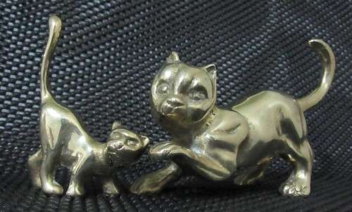 Two solid brass cat figurines circa 1960. Two different poses and pretty detailed faces. bid per eac