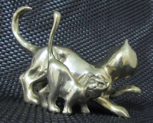Two solid brass cat figurines circa 1960. Two different poses and pretty detailed faces. bid per eac