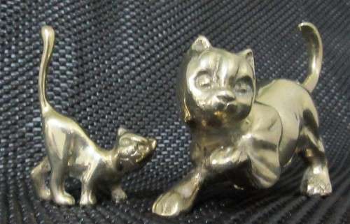 Two solid brass cat figurines circa 1960. Two different poses and pretty detailed faces. bid per eac