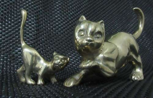 Two solid brass cat figurines circa 1960. Two different poses and pretty detailed faces. bid per eac