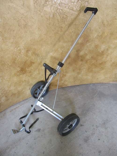 A golf push cart is used when a golfer wants to walk around the course but is not prepared to carry