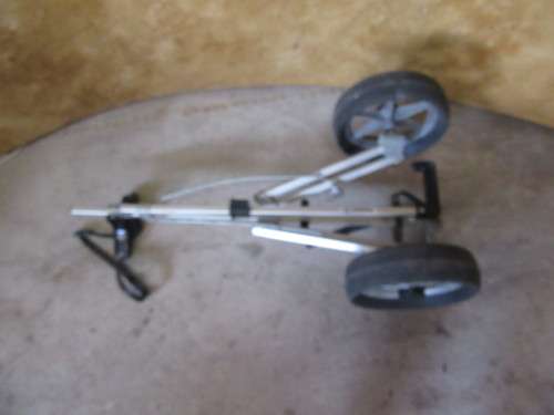 A golf push cart is used when a golfer wants to walk around the course but is not prepared to carry