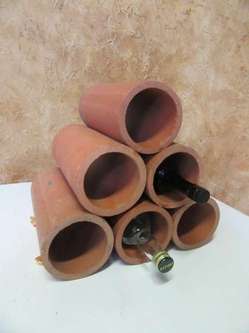 Six Very rustic terracotta wine coolers Soak the wine cooler in cold water for about 7 minutes.
