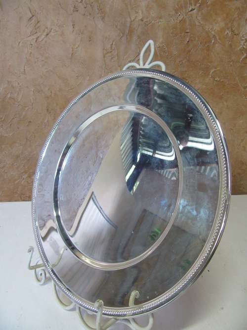 This timeless silver metal under plates will find itself on some of the best tables around.